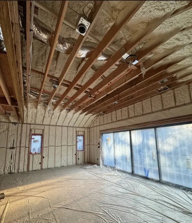 Interior walls and ceiling insulated with spray foam during new construction in Collegeville